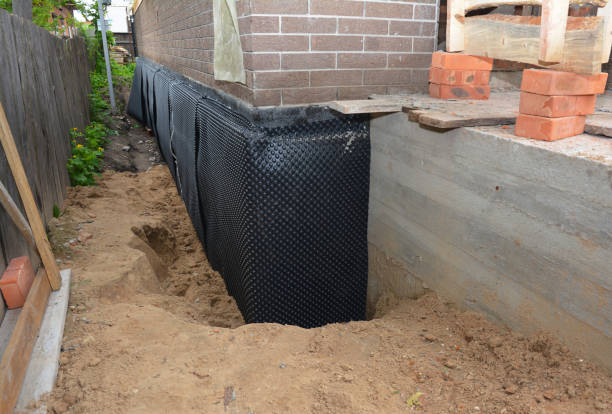 SJ Waterproofing Pros technician performing targeted Waterproofing assessment in Troutdale, OR